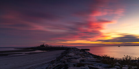 View of Fayerweather Lighthouse in Bridgeport Connecticut at sunset.