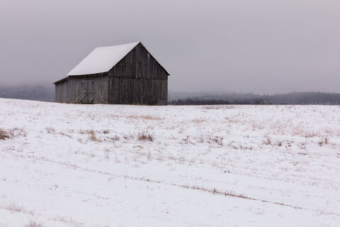 Barn covered in snow in Ripon in Queben, Canada.