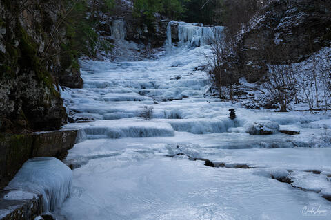 View of frozen Rensselaerville Falls upstate New York during winter.
