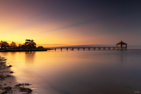 View of pier in Fontainebleu State Park in Louisiana at sunrise.