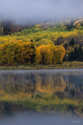 Mist and fall reflections in Beaver Lake in Marble, Colorado.