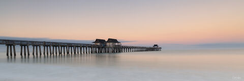 View of Naples Pier in Naples in Florida at sunrise.