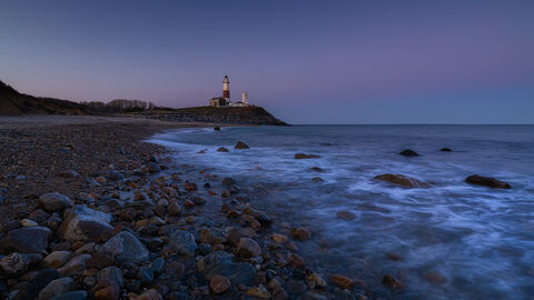 View of Montauk Point Lighthouse in Mountauk in New York at sunset.