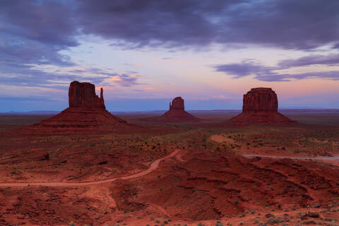 View of the sandstone towers at sunset in Monument Valley on the Arizona-Utah border.