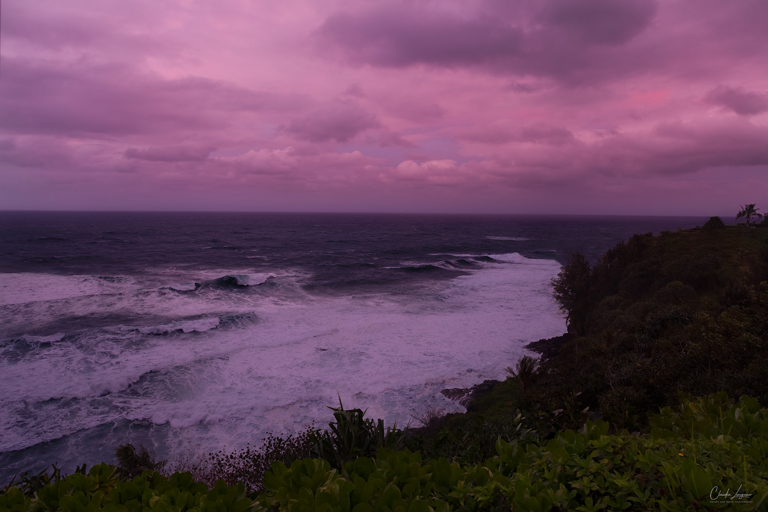 Dramatic sunset and waves at The Cliffs Resort in Princeville on Kauai Island in Hawaii.