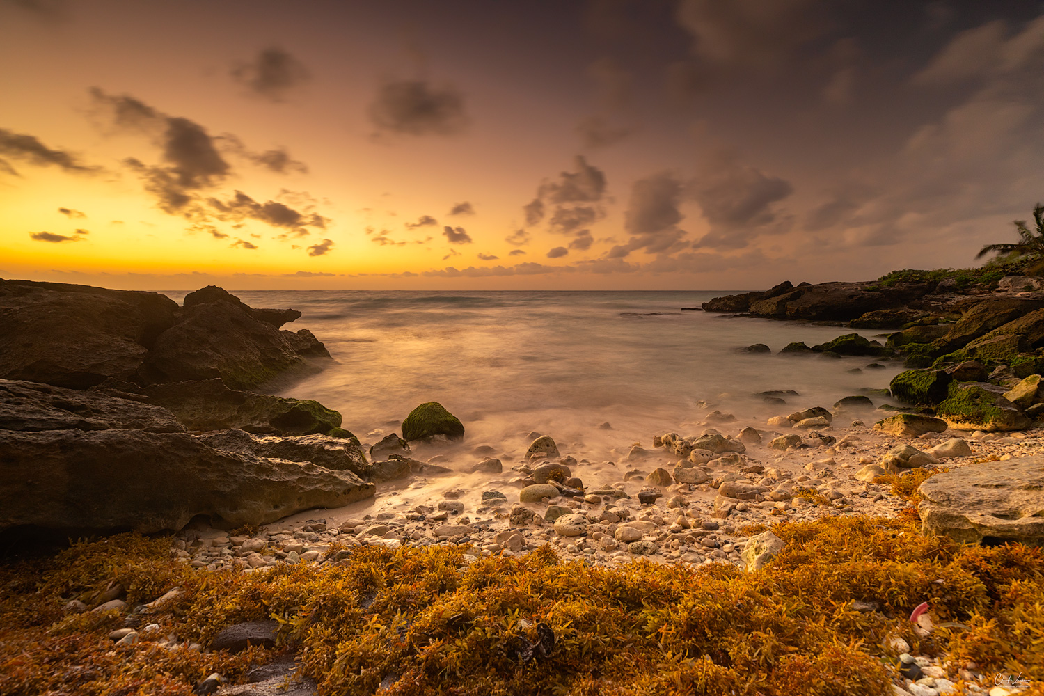 Sunrise at a small beach in Tulum in Mexico.