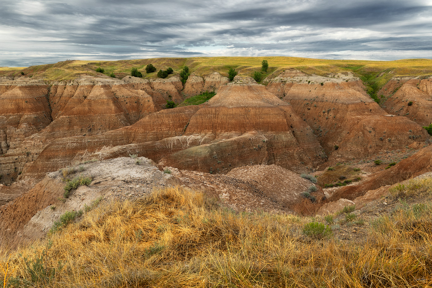 View of colorful buttes at Badlands National Park in South Dakota at sunrise.