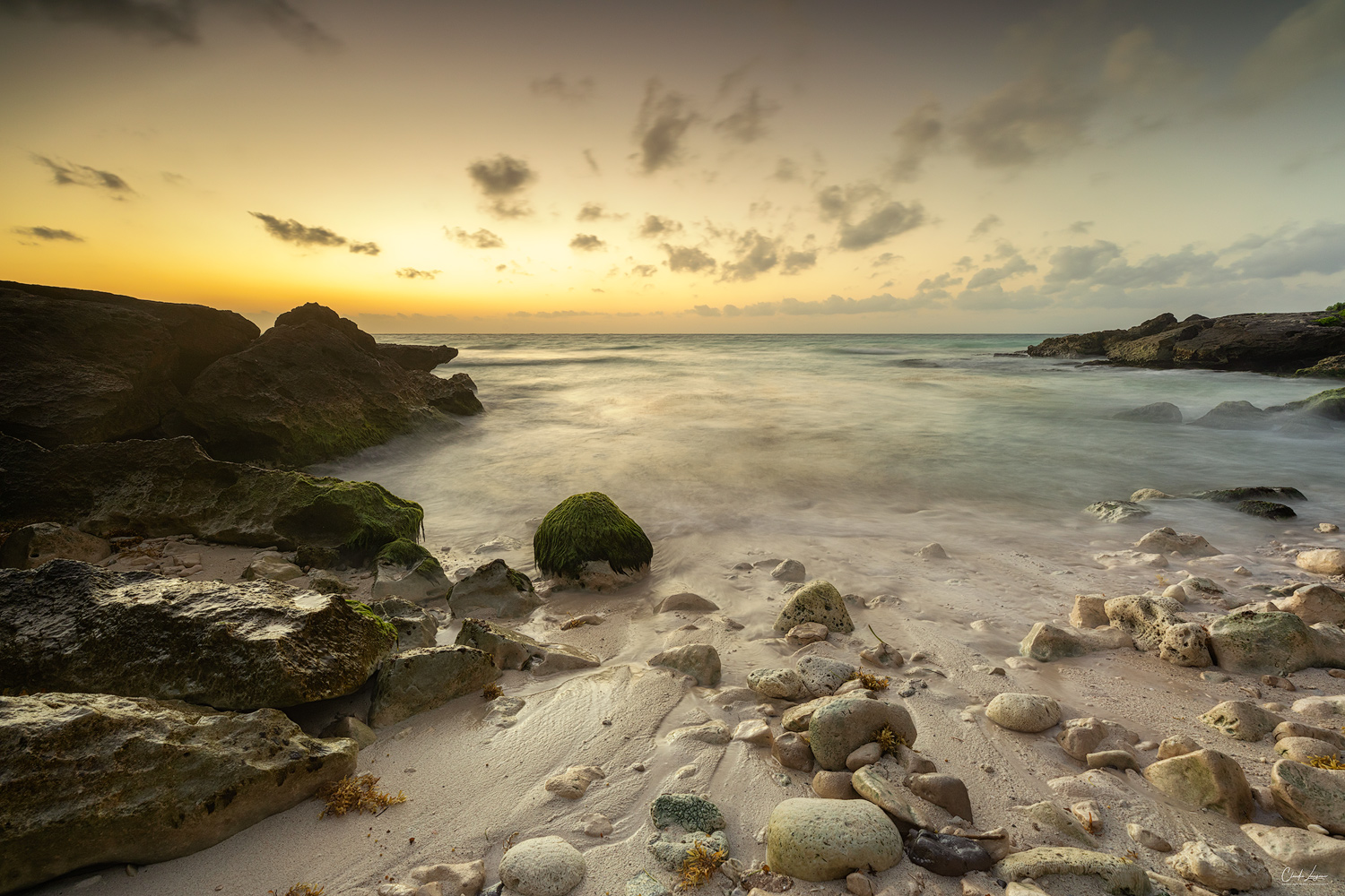 Sunrise at a small beach in Tulum in Mexico.