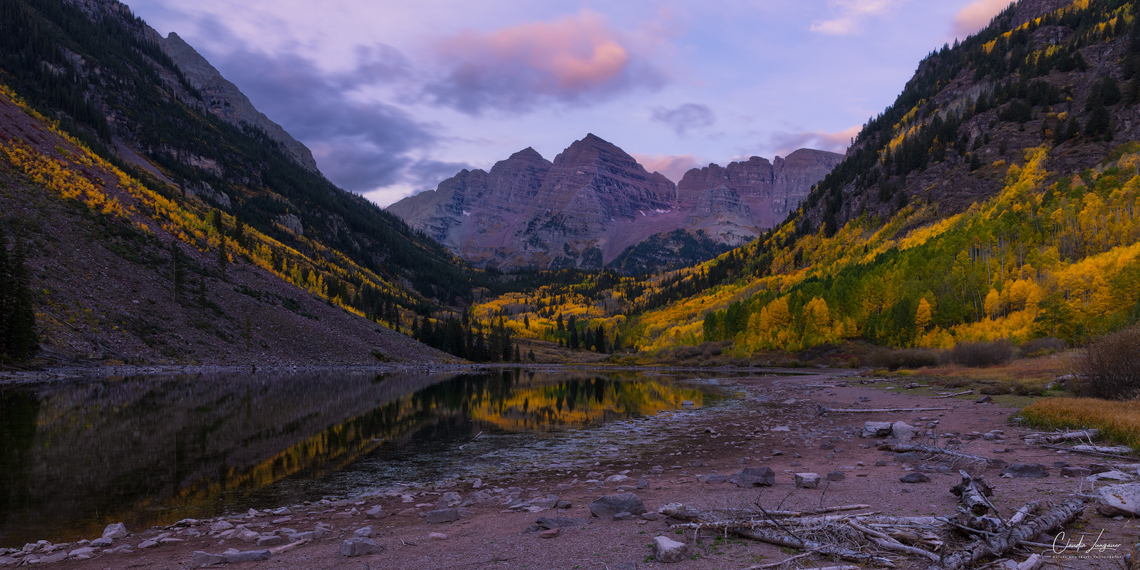 Sunrise at Maroon Lake with view of Maroon Bells.