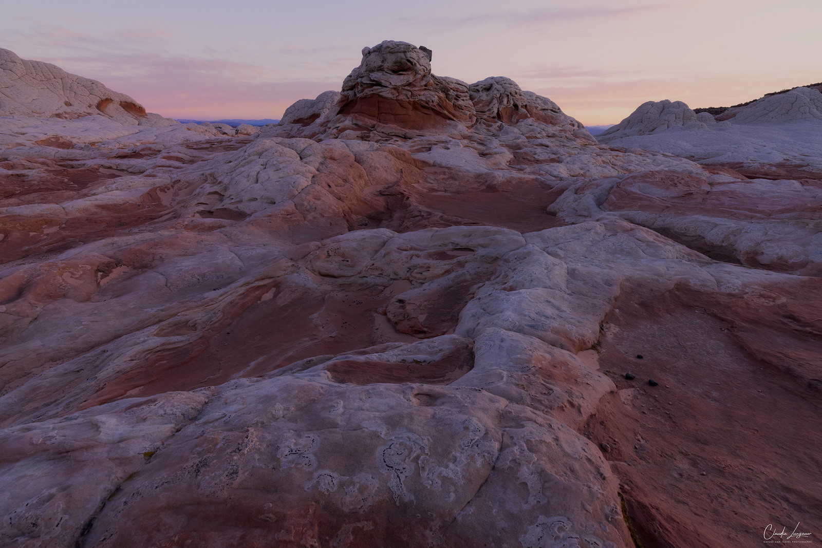 View of rock formations in White Pocket in Arizona at sunrise.