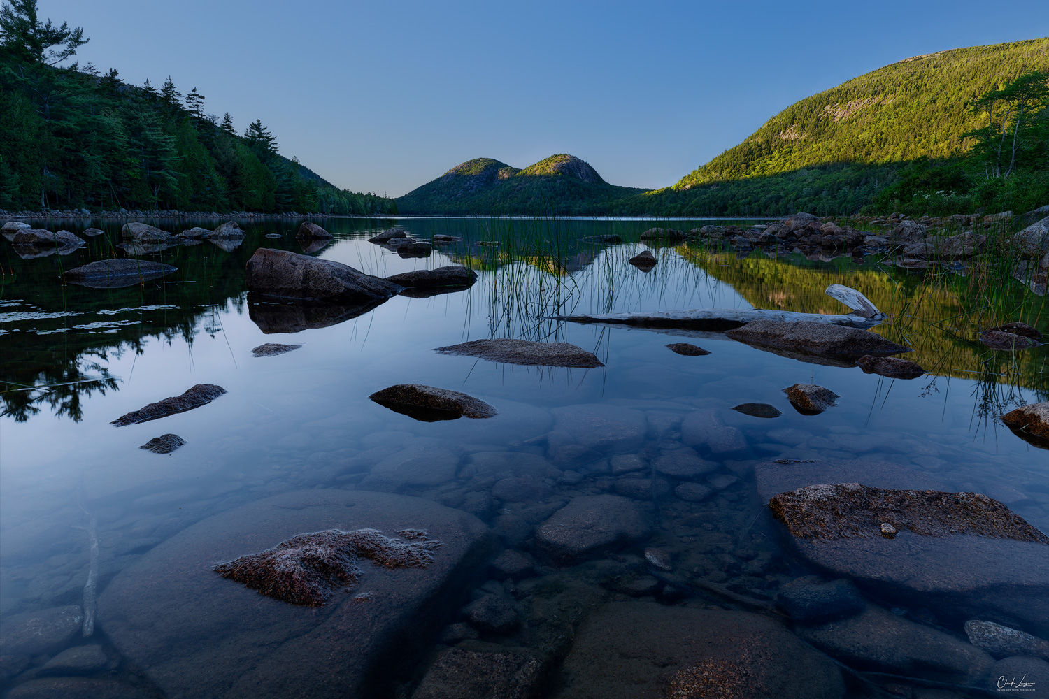 View of the Bubbles at Jordan Pond in Acadia National Park at sunset.