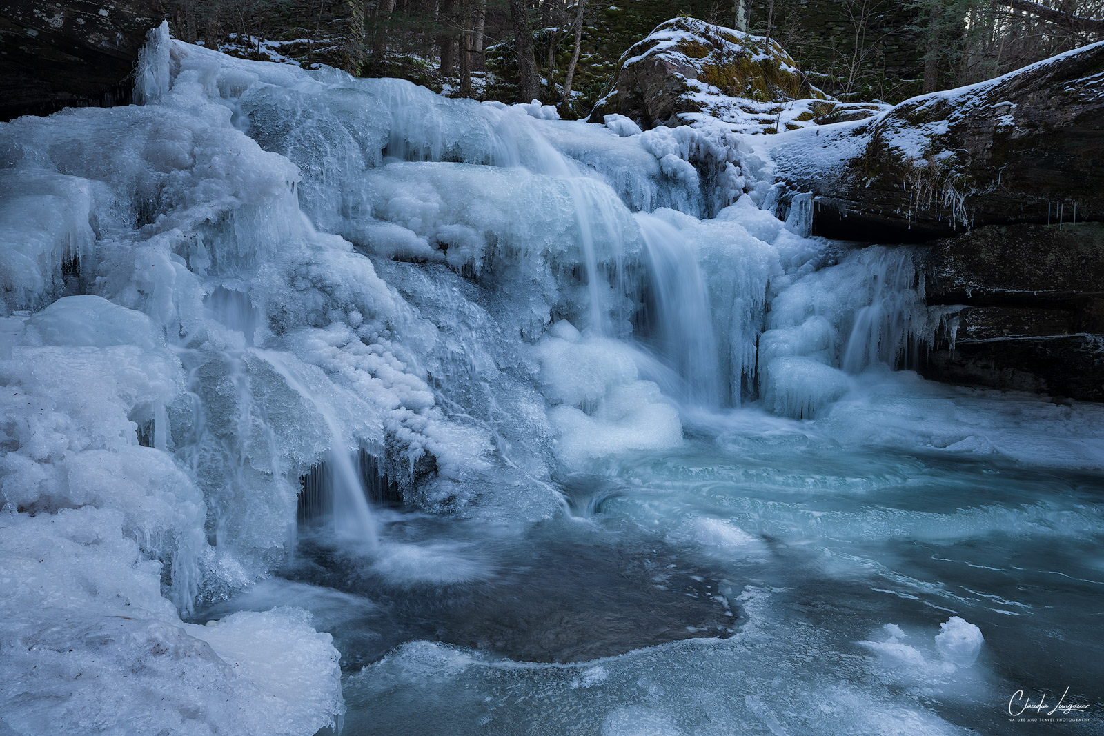 View of frozen Tompkins Falls upstate New York during winter.